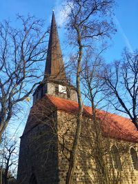 Low angle view of church against blue sky