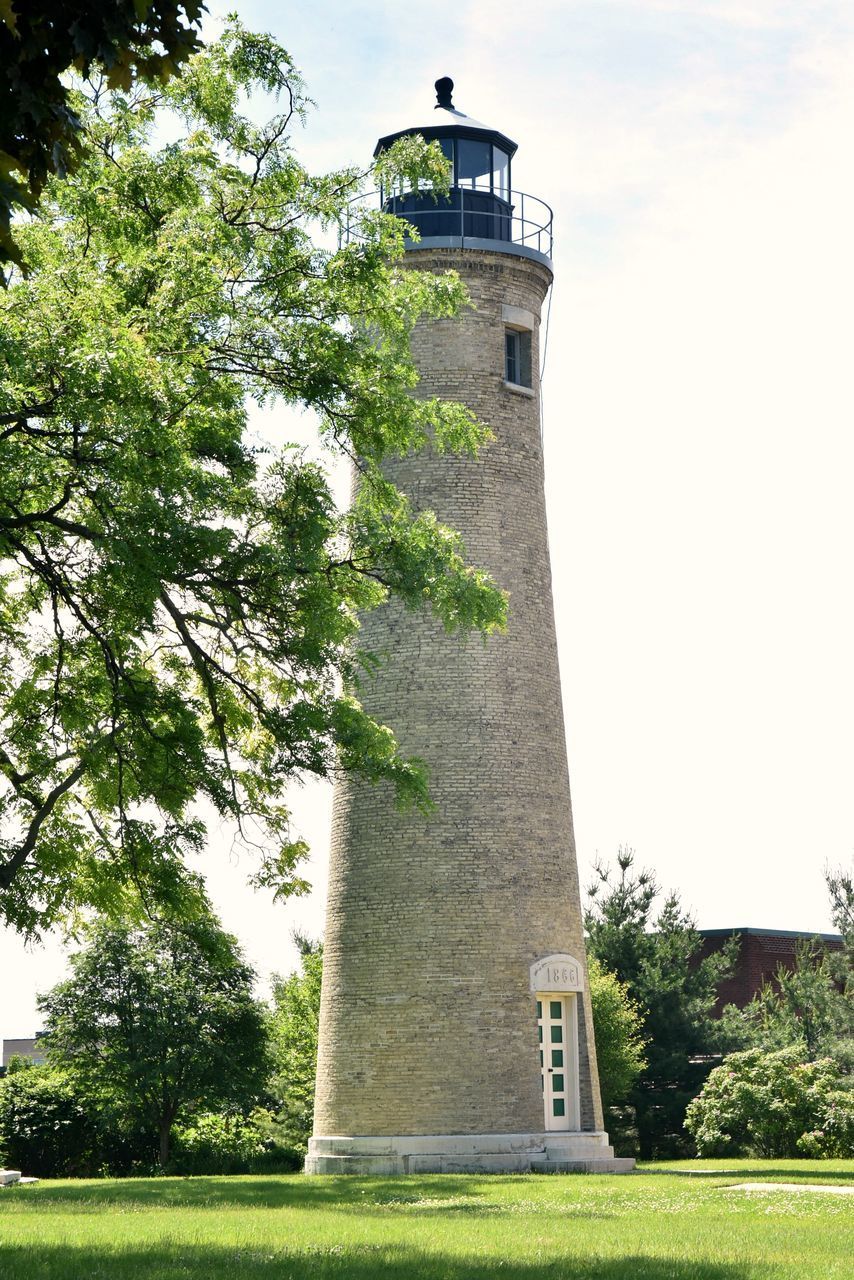 LOW ANGLE VIEW OF LIGHTHOUSE AGAINST BUILDING