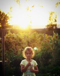 Portrait of smiling child holding flowers