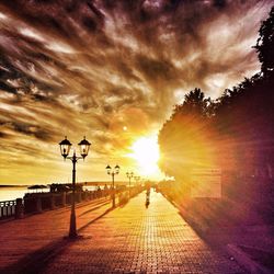 Scenic view of road against cloudy sky