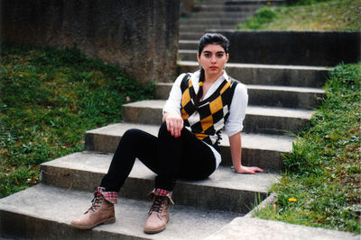 Portrait of woman sitting outdoors