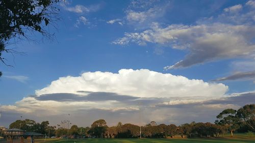 Panoramic view of city against cloudy sky