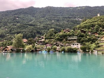 Scenic view of swimming pool by buildings against sky