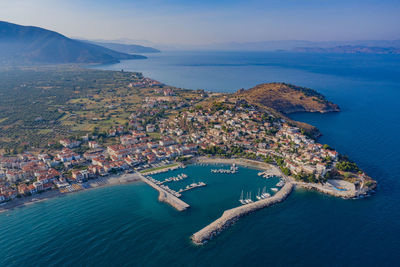 High angle view of sea and cityscape against sky