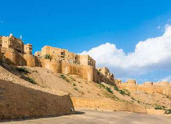 Ruins of building against blue sky