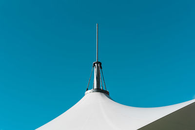 Spire of tent against sky
