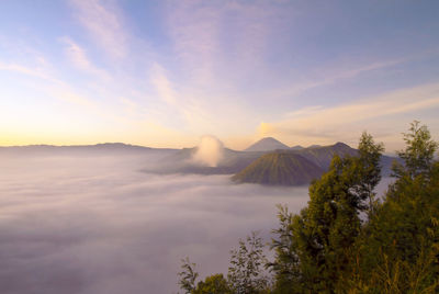 View of volcanic landscape against cloudy sky