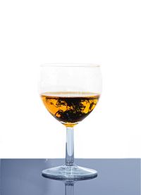 Close-up of drink over white background