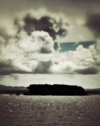 Scenic view of sea against cloudy sky