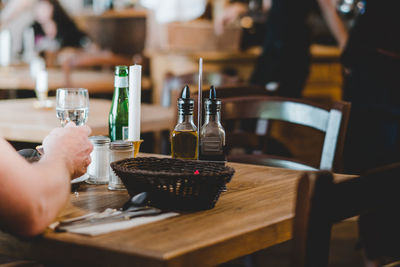 Close-up of hands on table