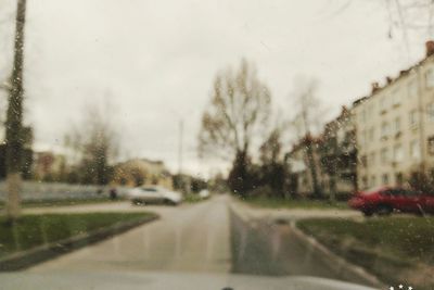 Wet road seen through car window