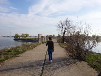 Full length of woman standing in water