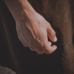 Close-up of hands against blurred background