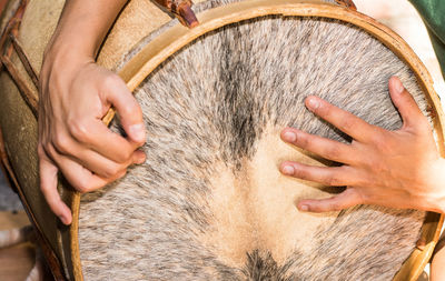 Close-up of hand playing drums