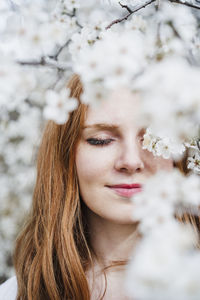 Portrait of woman against plants