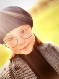 Close-up portrait of a smiling young woman