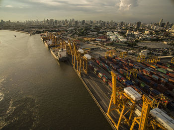 Aerial view above bangkok dockyard with cargo ships waiting to be upload and offload containers