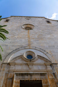 Low angle view of ornate building against sky