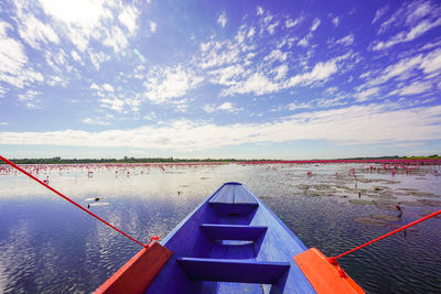 Close-up of boat moored on lake