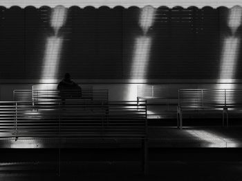 Blurred motion of people sitting on staircase