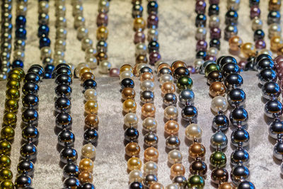 High angle view of bead necklaces for sale