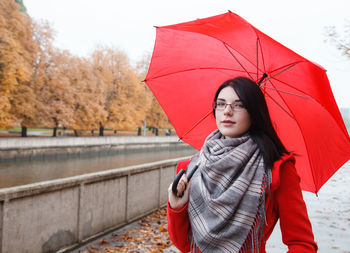 Portrait of woman standing in rain