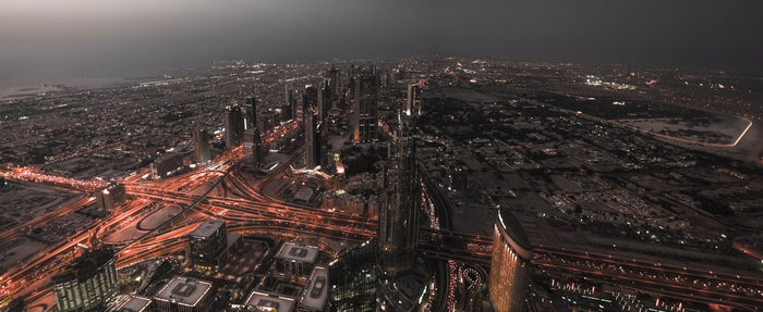 Panoramic view of cityscape at night