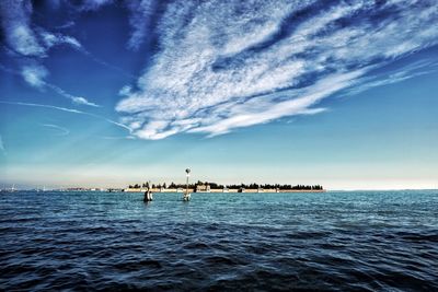 Scenic view of sea against blue sky