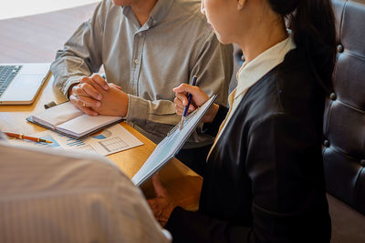 Close-up of people working