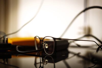 Close-up of eyeglasses on cable