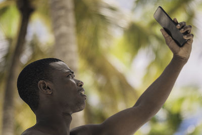 Low angle view of man looking away