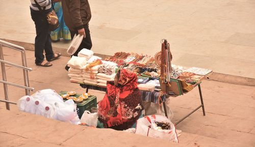 Low section of people standing on street market