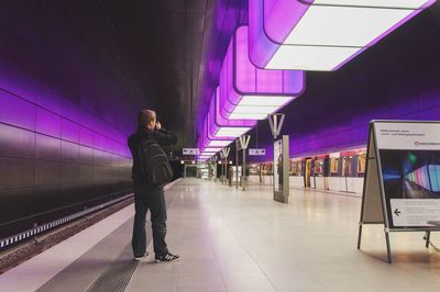 Woman walking on subway platform