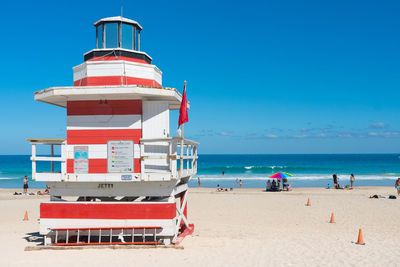 One of the famous and colorful beach guard cabins on miami beach during a sunny day