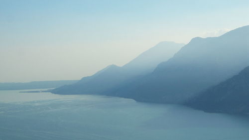 Scenic view of mountains against clear sky during winter