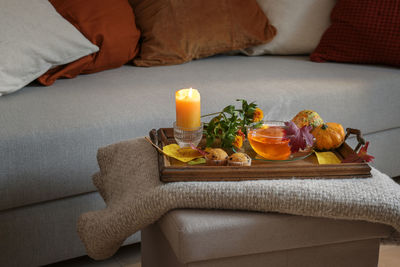 Close-up of christmas decorations on sofa at home