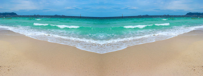 Scenic view of beach against sky