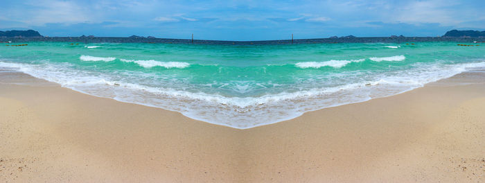 Scenic view of beach against sky