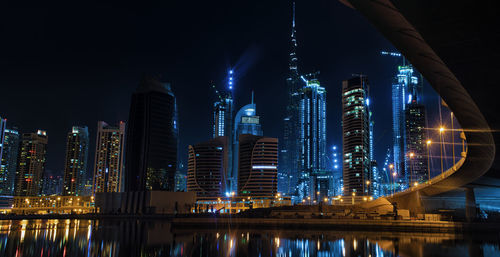 Low angle view of skyscrapers lit up at night