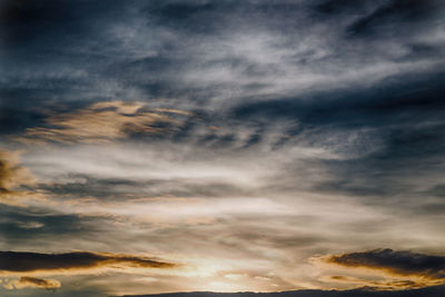 Low angle view of cloudy sky during sunset