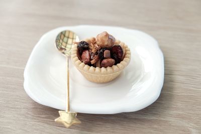 High angle view of tart in plate on table