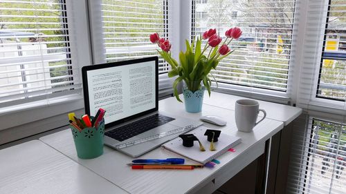 Flower vase on window sill