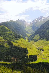 Scenic view of landscape and mountains against sky