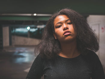 Portrait of a beautiful young woman looking away