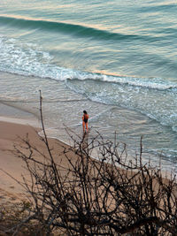 High angle view of man standing on beach