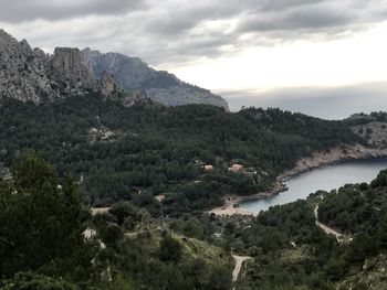 Scenic view of landscape and mountains against sky