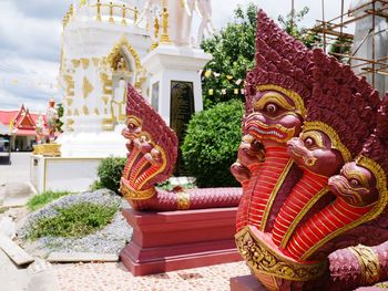 Statue of temple against building