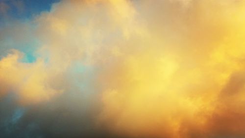 Low angle view of cloudy sky at sunset