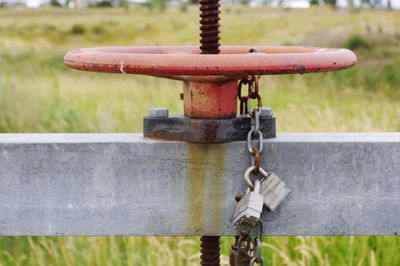 Close-up of valve on railing