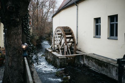 Abandoned building by canal